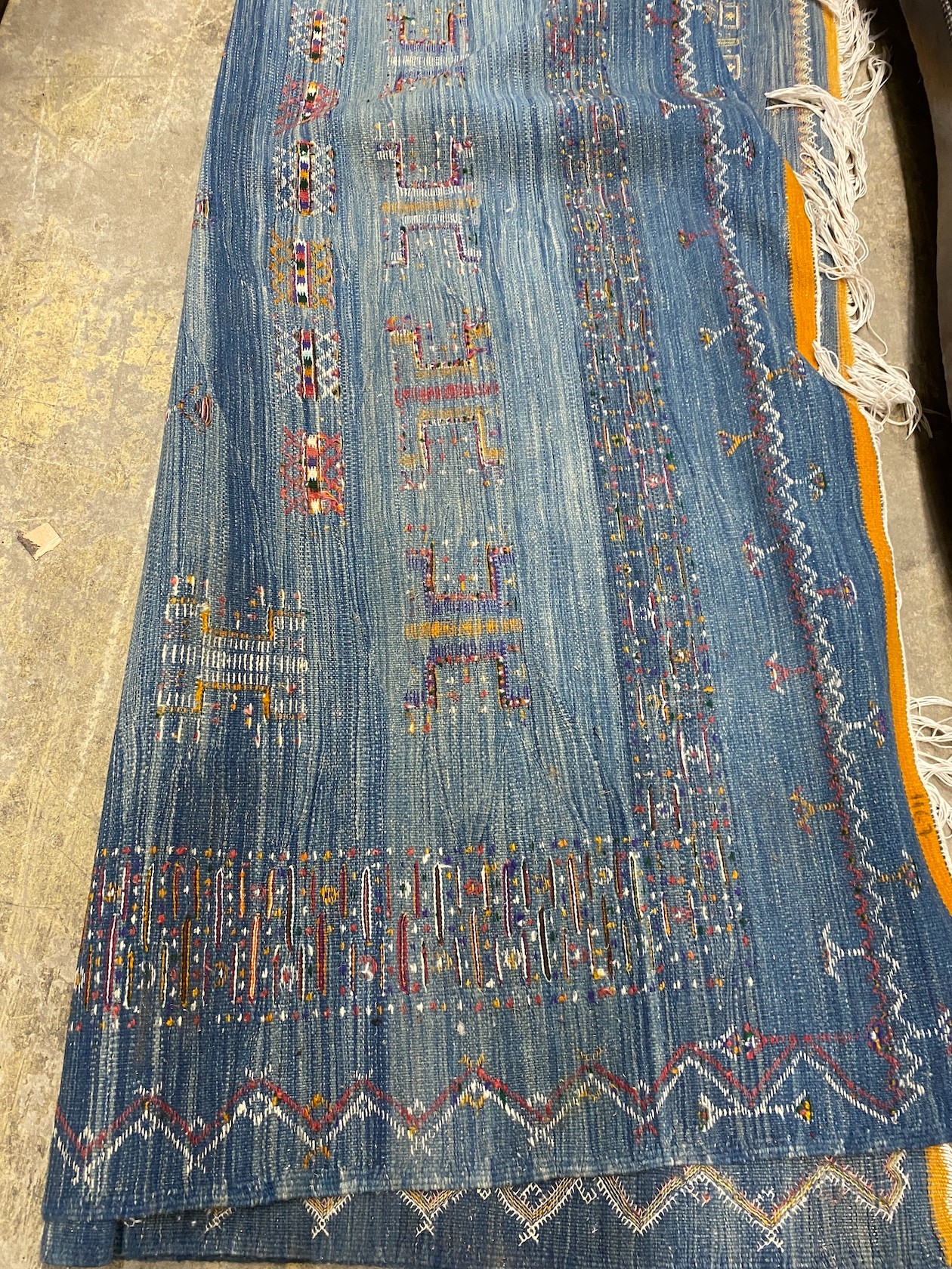 A Kilim polychrome carpet, approx. 320 x 200cm